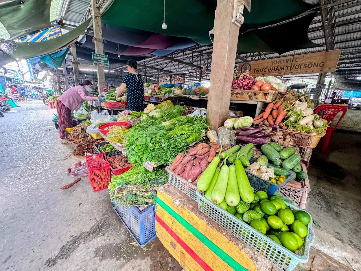 Vegetable stalls inside Mỹ Lồng market in Ben Tre