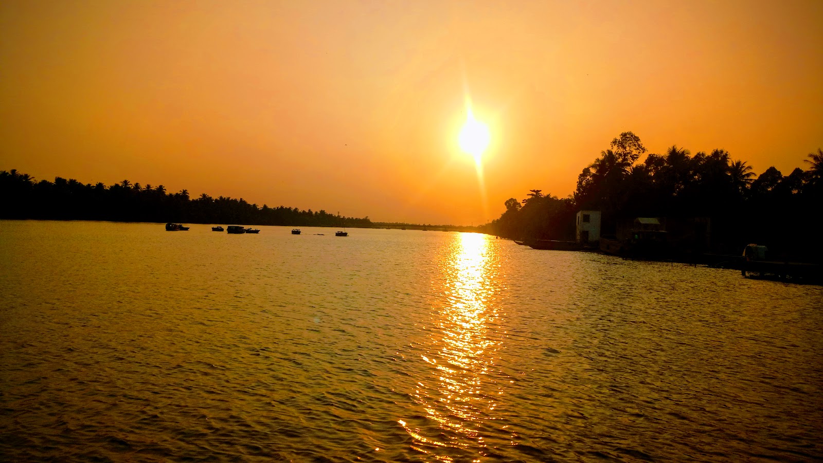 Sunset reflected on a river in Ben Tre